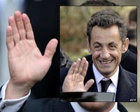 Nicolas Sarkozy hands are purposeful and held to make points